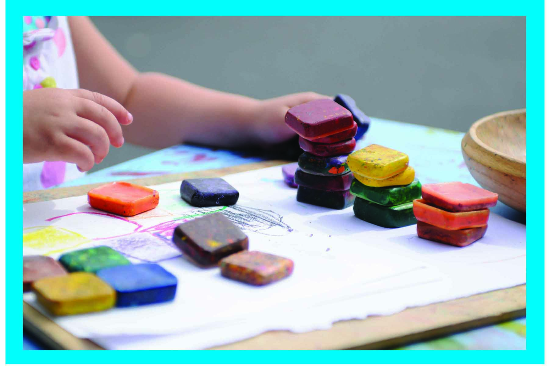 child playing with colour blocks